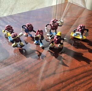 7 California Raison Collectibles Surfer Roller Skater Boom Box Trumpet Guitar